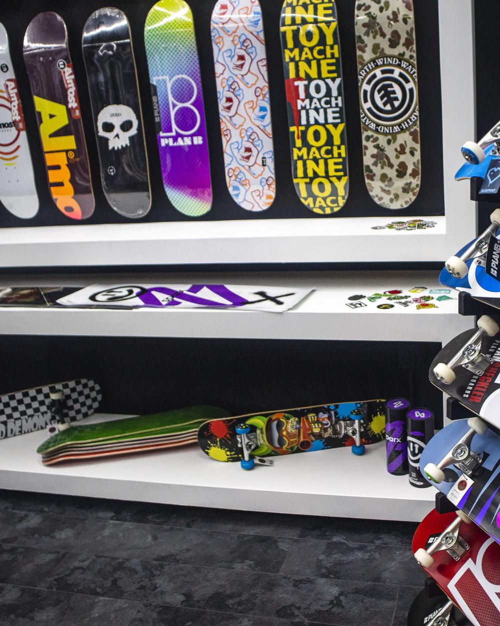 Skateboard decks on the wall at SPARX Board Co.